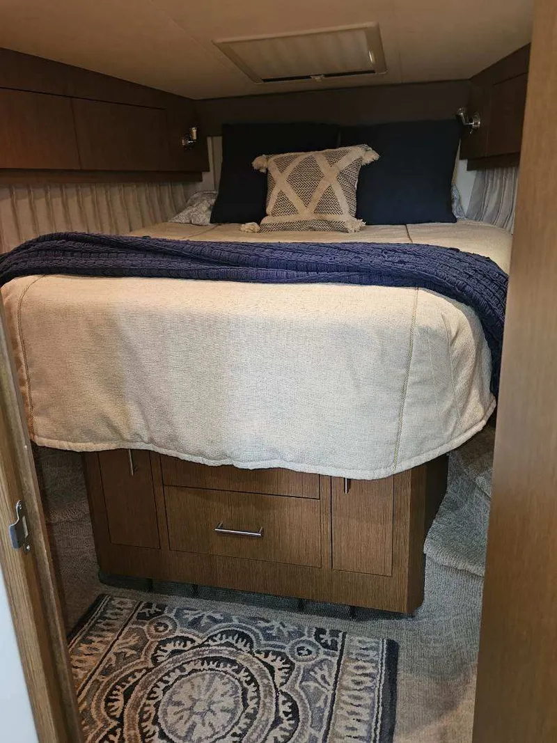 Slide: The Image of Interior of 2012 Carver 36 Mariner with cozy bed. - 35
