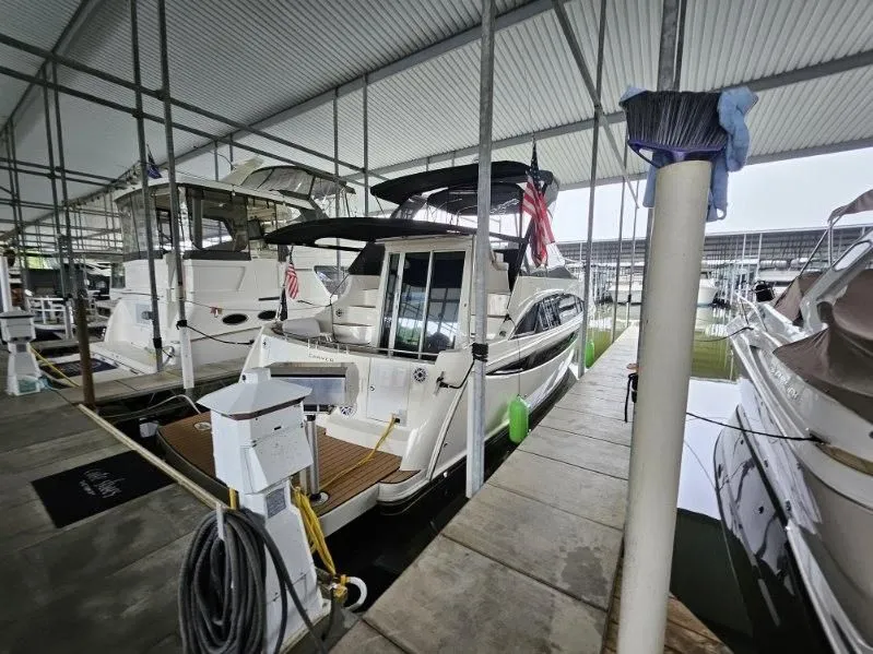 Slide: The Image of 2012 Carver 36 Mariner yacht docked in marina. - 36