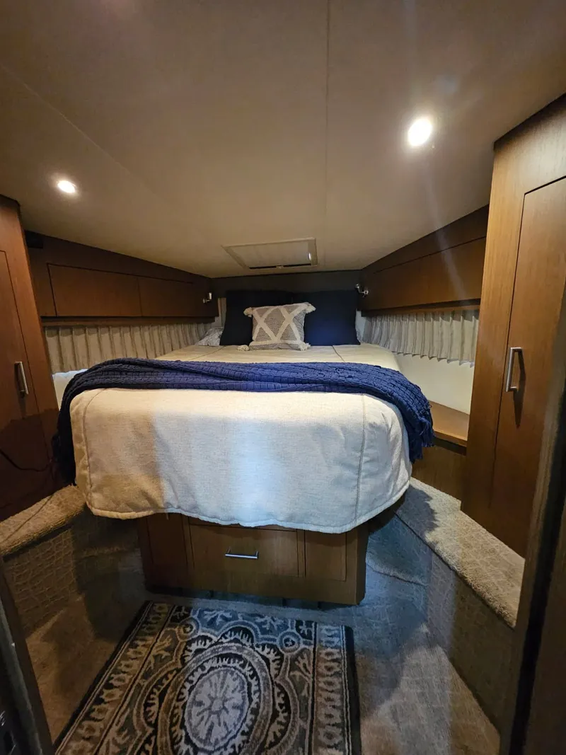 Slide: The Image of Interior of 2012 Carver 36 Mariner featuring cozy bedroom. - 37