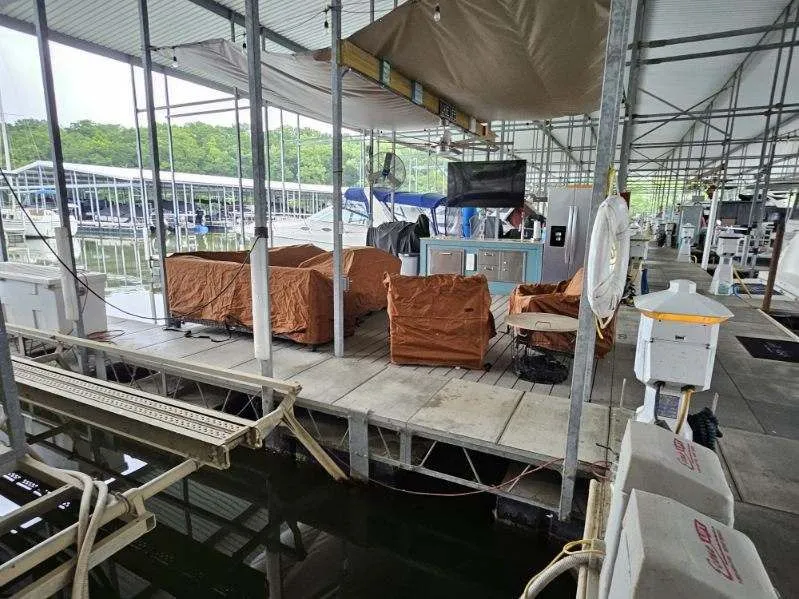 Slide: The Image of Carver 36 Mariner 2012 in covered dock with furniture. - 39