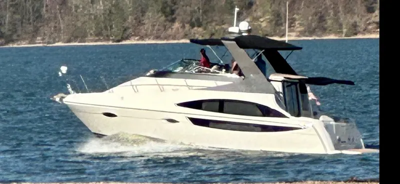 Slide: The Image of Carver 36 Mariner 2012 cruising on a serene lake. - 7