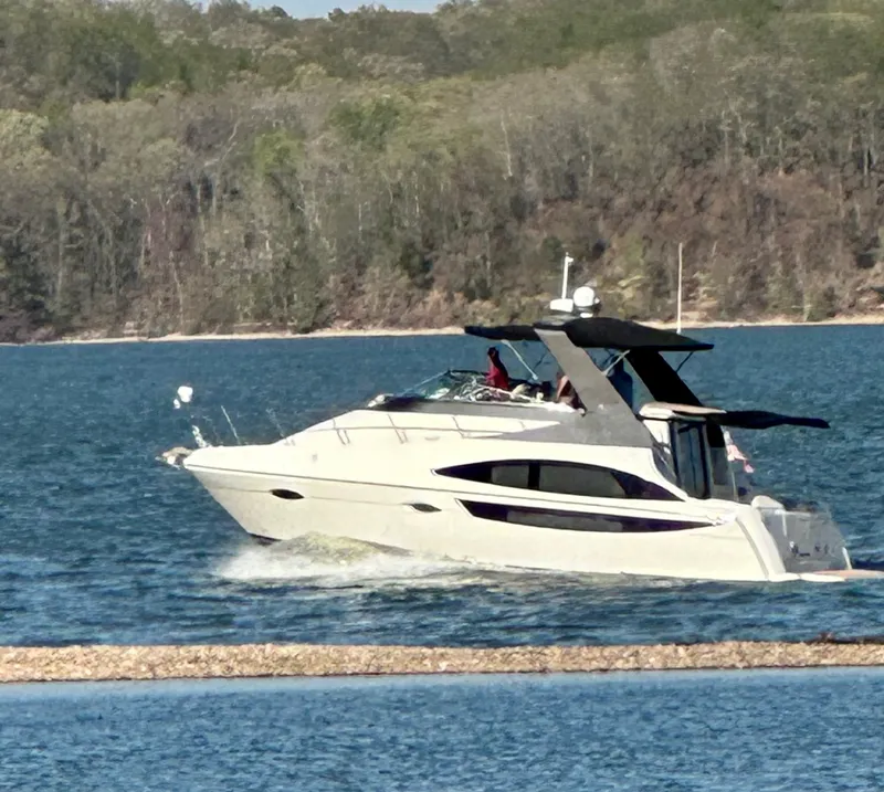 Slide: The Image of Carver 36 Mariner 2012 cruising on a serene lake. - 8