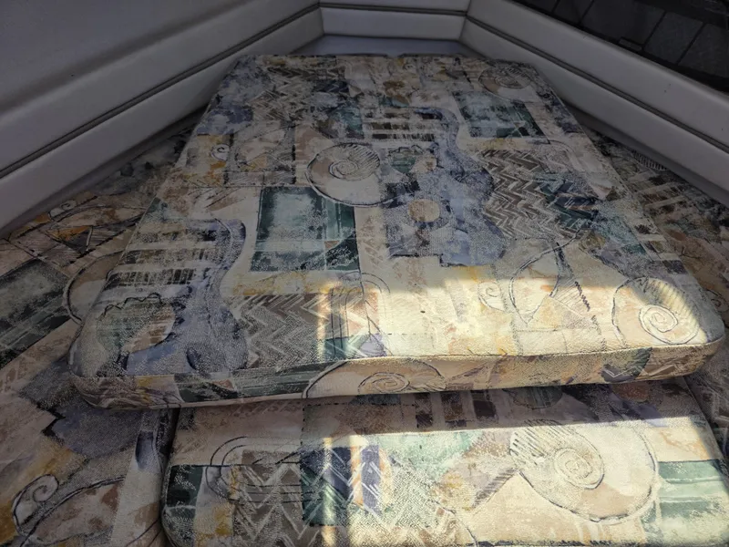 Slide: The Image of Interior of a 2002 Grady-White Seafarer 226 boat with patterned cushions. - 21
