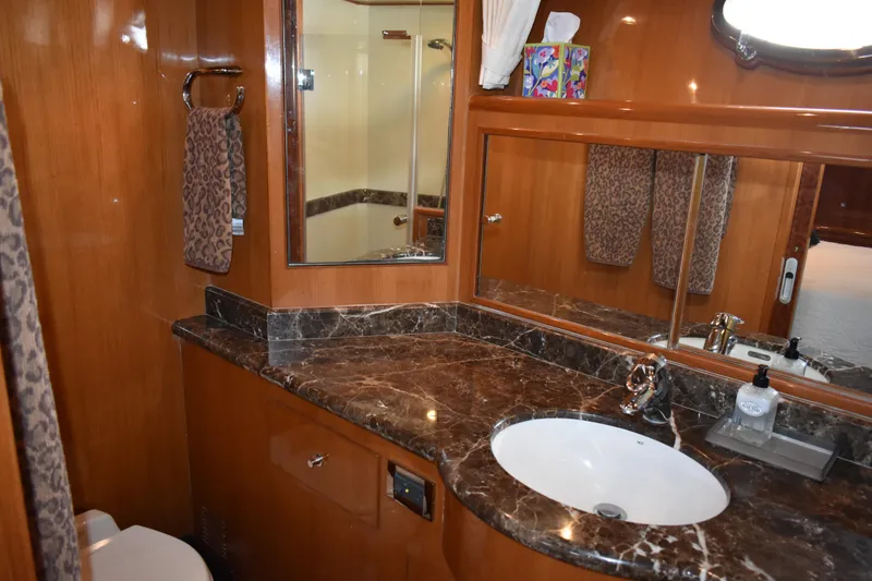 Slide: The Image of Luxurious bathroom in 2004 Ocean Alexander 64 Pilothouse yacht with marble countertop. - 59