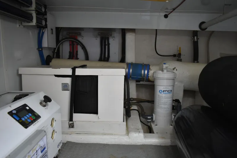 Slide: The Image of Engine room of 2004 Ocean Alexander 64 Pilothouse with equipment and piping. - 88