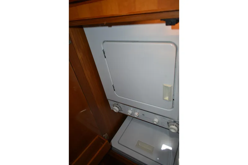 Slide: The Image of Stacked washer and dryer in 2004 Ocean Alexander 64 Pilothouse yacht. - 71