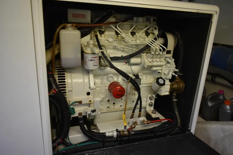 Slide: The Image of Engine compartment of a 2004 Ocean Alexander 64 Pilothouse yacht, showcasing detailed components. - 75