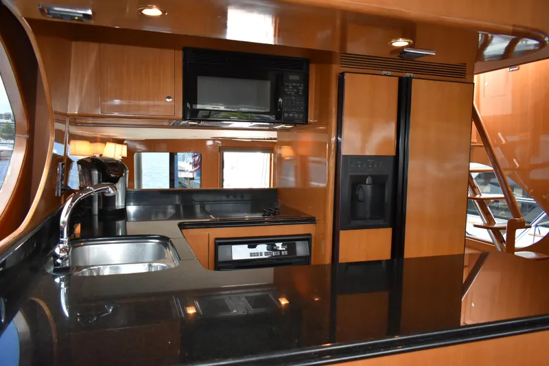Slide: The Image of Luxurious kitchen interior of 2004 Ocean Alexander 64 Pilothouse yacht with modern appliances. - 42