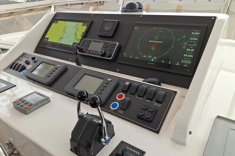 Slide: The Image of Control panel of a 2004 Ocean Alexander 64 Pilothouse yacht with navigation displays. - 22