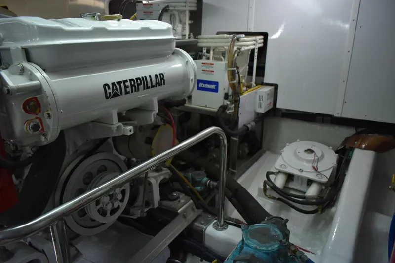 Slide: The Image of Engine room of 2004 Ocean Alexander 64 Pilothouse with Caterpillar engine. - 80