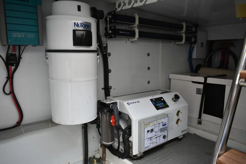 Slide: The Image of Engine room of 2004 Ocean Alexander 64 Pilothouse with equipment and machinery. - 84