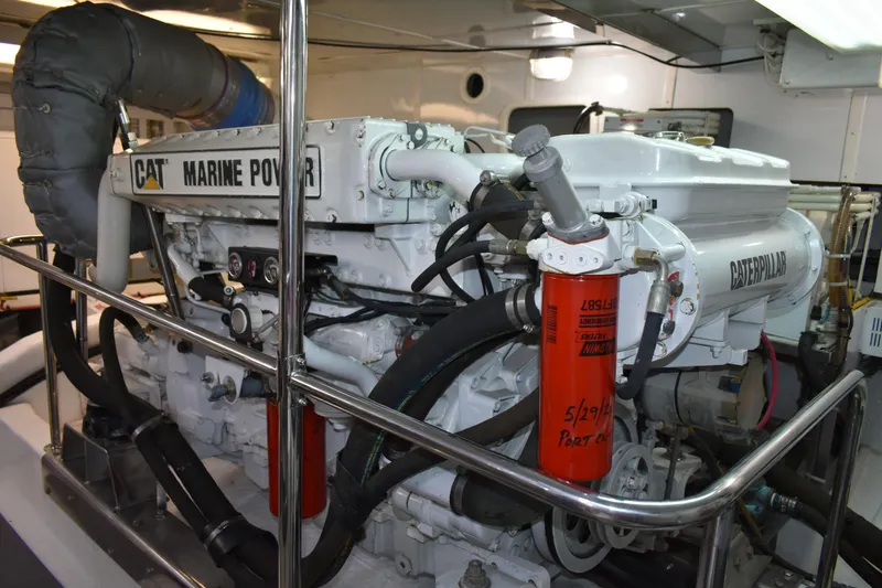 Slide: The Image of Engine room of 2004 Ocean Alexander 64 Pilothouse with Caterpillar marine engine. - 81