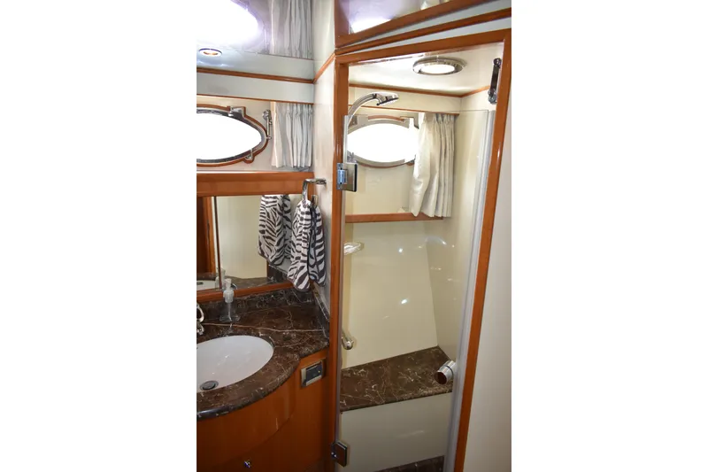 Slide: The Image of Luxurious bathroom in 2004 Ocean Alexander 64 Pilothouse yacht with marble countertop. - 64