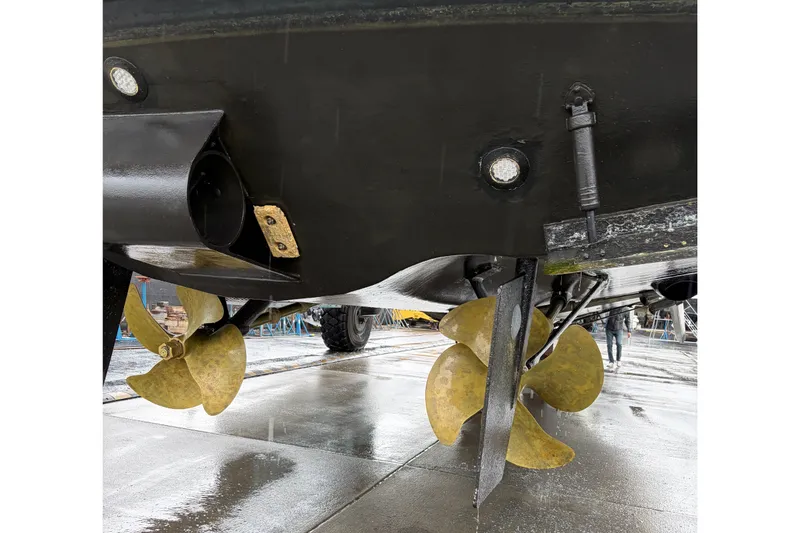 Slide: The Image of Underwater view of 2004 Ocean Alexander 64 Pilothouse propellers and rudder. - 97