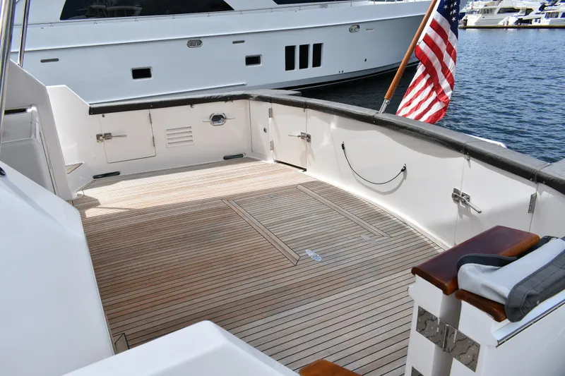 Slide: The Image of Spacious deck of 2004 Ocean Alexander 64 Pilothouse yacht with American flag. - 5