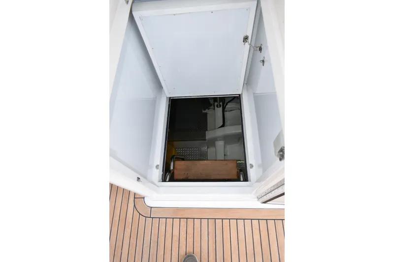 Slide: The Image of Engine room access hatch on 2004 Ocean Alexander 64 Pilothouse yacht. - 19
