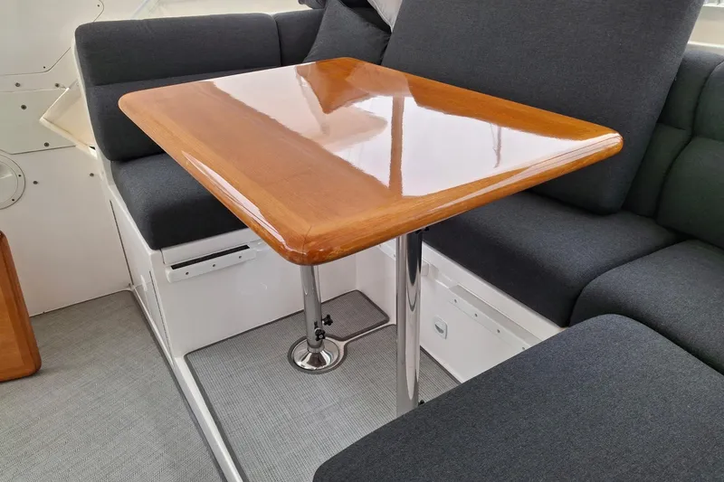 Slide: The Image of Luxurious seating area with polished wood table on 2004 Ocean Alexander 64 Pilothouse yacht. - 25