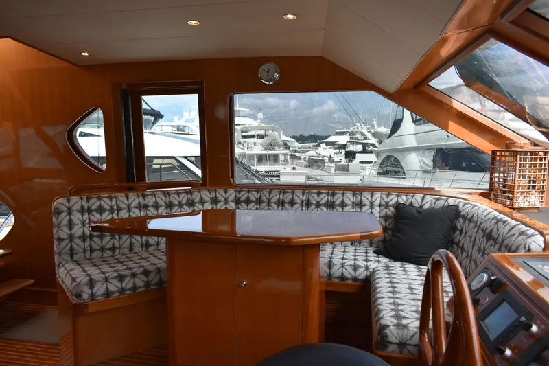 Slide: The Image of Luxurious interior of 2004 Ocean Alexander 64 Pilothouse yacht with elegant seating and table. - 34