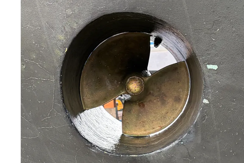 Slide: The Image of Close-up of a 2004 Ocean Alexander 64 Pilothouse propeller in a thruster tunnel. - 96