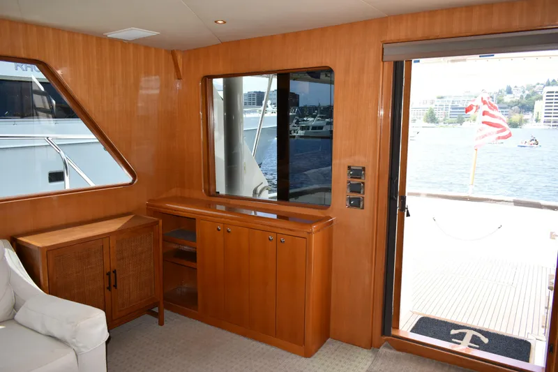 Slide: The Image of Luxurious interior of 2004 Ocean Alexander 64 Pilothouse yacht with waterfront view. - 50