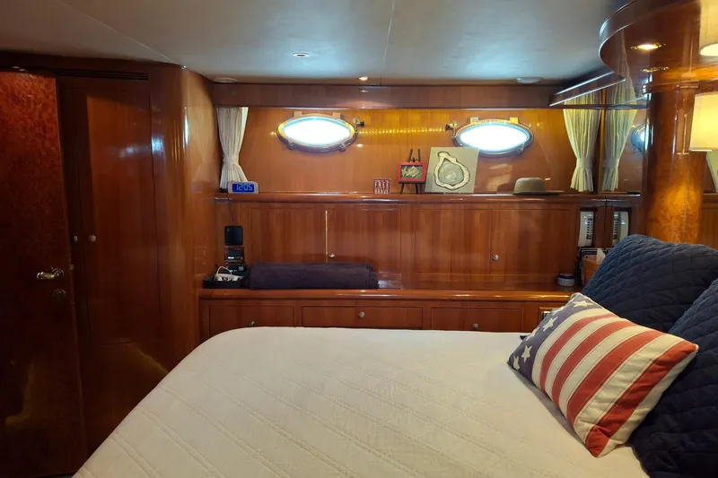 Slide: The Image of Luxurious cabin interior of 2004 Ocean Alexander 64 Pilothouse yacht with elegant wood finish. - 52