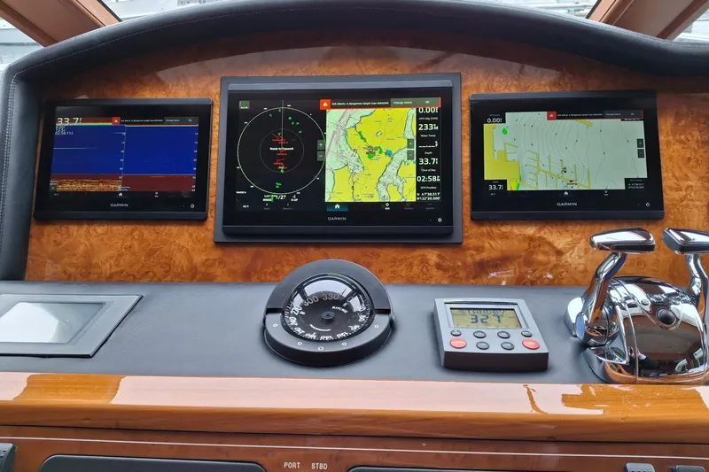 Slide: The Image of Dashboard of a 2004 Ocean Alexander 64 Pilothouse with Garmin navigation displays. - 38