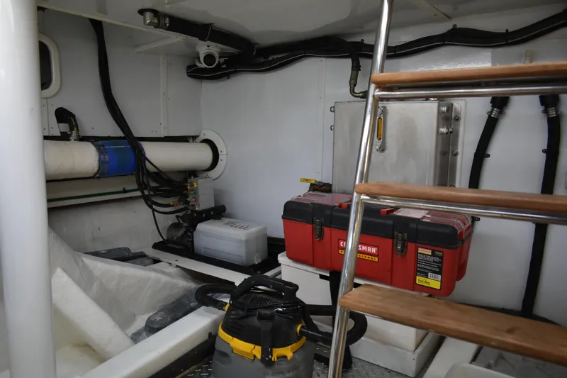 Slide: The Image of Engine room of 2004 Ocean Alexander 64 Pilothouse with tools and equipment. - 73