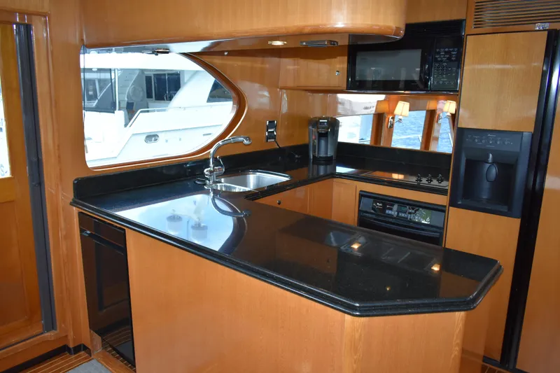 Slide: The Image of Luxurious kitchen interior of 2004 Ocean Alexander 64 Pilothouse yacht with modern amenities. - 41