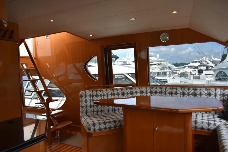 Slide: The Image of Luxurious interior of 2004 Ocean Alexander 64 Pilothouse yacht with elegant wood finishes. - 33