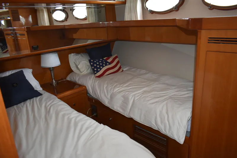 Slide: The Image of Cozy twin cabin in 2004 Ocean Alexander 64 Pilothouse yacht with wooden interior. - 61