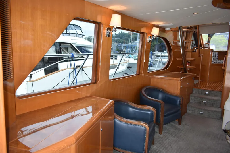 Slide: The Image of Luxurious interior of 2004 Ocean Alexander 64 Pilothouse yacht with elegant wood finish. - 46