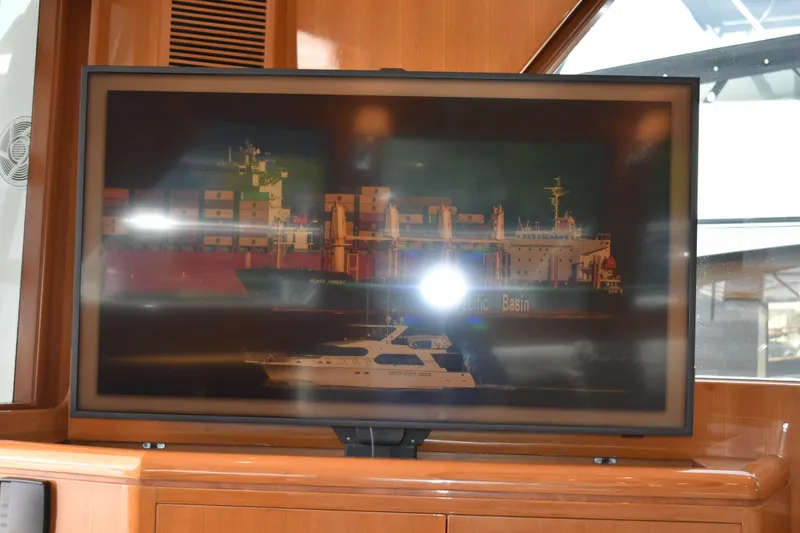Slide: The Image of Television displaying a ship image inside a 2004 Ocean Alexander 64 Pilothouse yacht. - 49