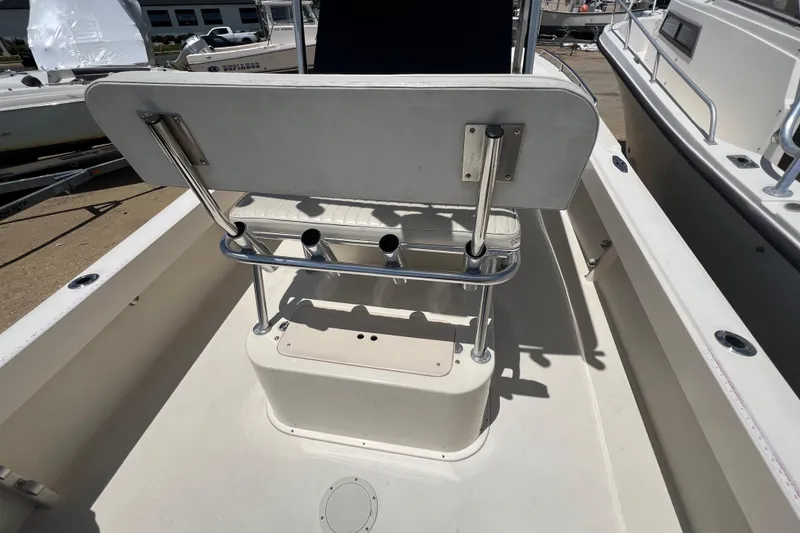 Slide: The Image of 2004 Parker 2300 Special Edition boat interior with seating and rod holders. - 12