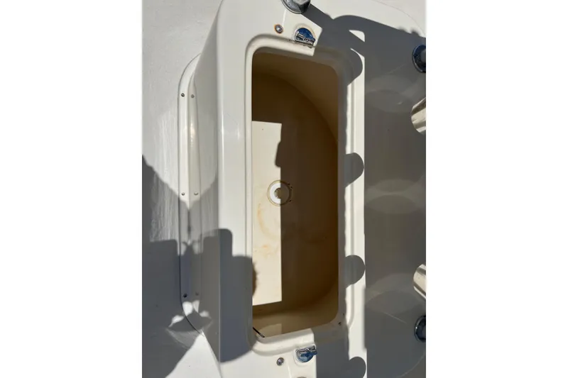 Slide: The Image of Open storage compartment on a 2004 Parker 2300 Special Edition boat. - 13