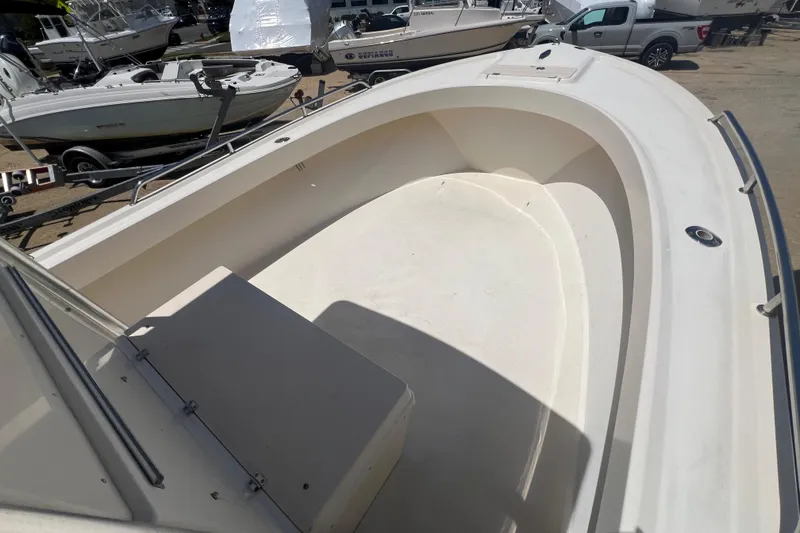 Slide: The Image of 2004 Parker 2300 Special Edition boat interior, showcasing spacious deck and seating area. - 6