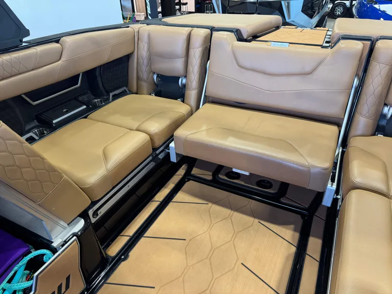 Slide: The Image of Interior of a 2021 Malibu M240 with brown leather seats. - 14