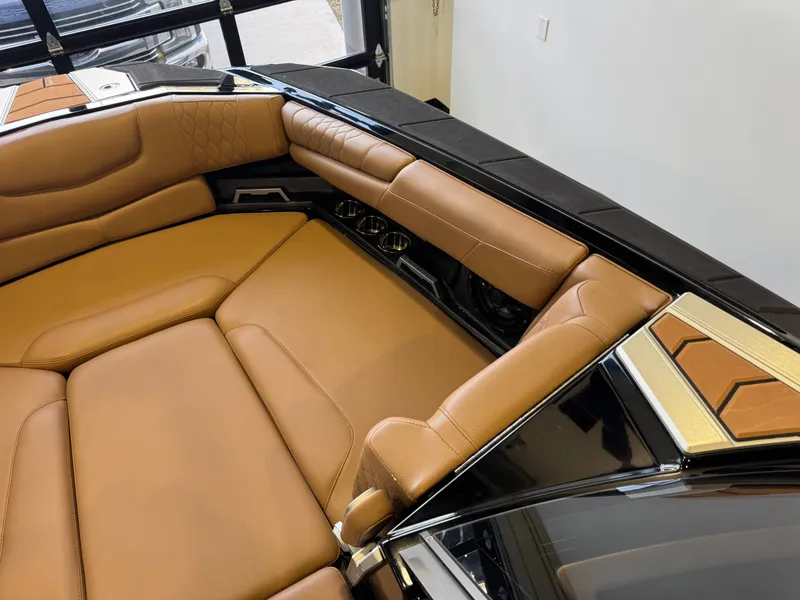 Slide: The Image of Interior of a 2021 Malibu M240 with luxurious leather seating. - 16