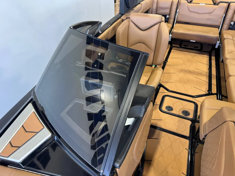 Slide: The Image of Interior of a 2021 Malibu M240 boat with luxurious leather seating. - 18
