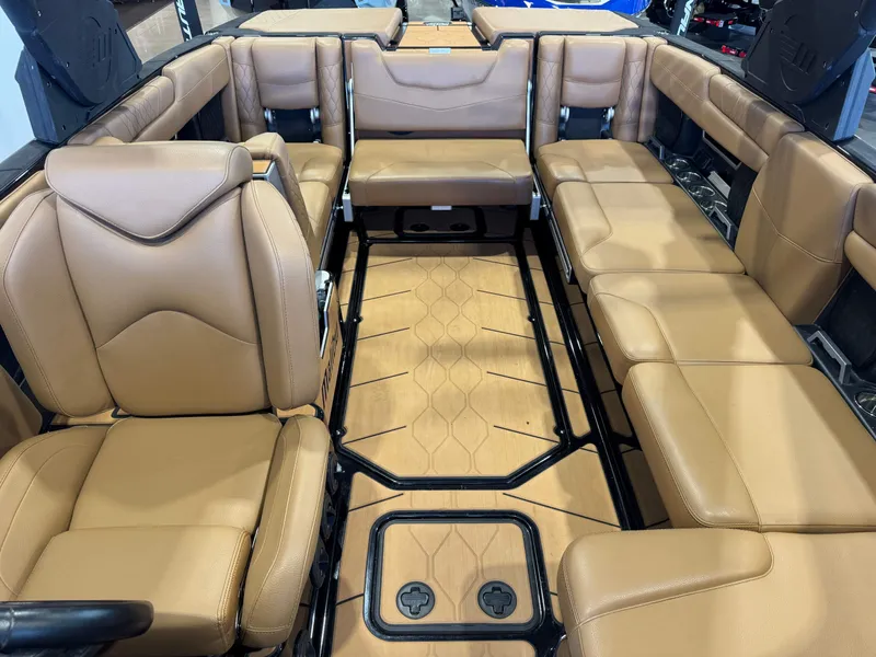 Slide: The Image of Interior of a 2021 Malibu M240 boat with beige leather seating. - 20
