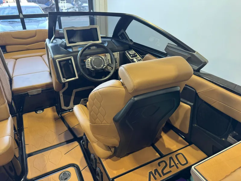 Slide: The Image of Interior of a 2021 Malibu M240 boat with luxurious features. - 22