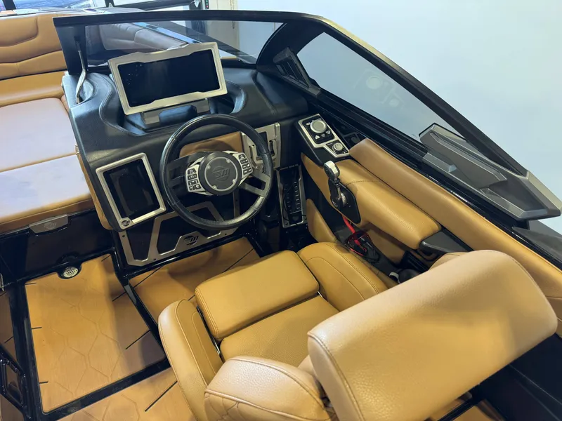 Slide: The Image of Interior of a 2021 Malibu M240 boat with modern dashboard. - 23