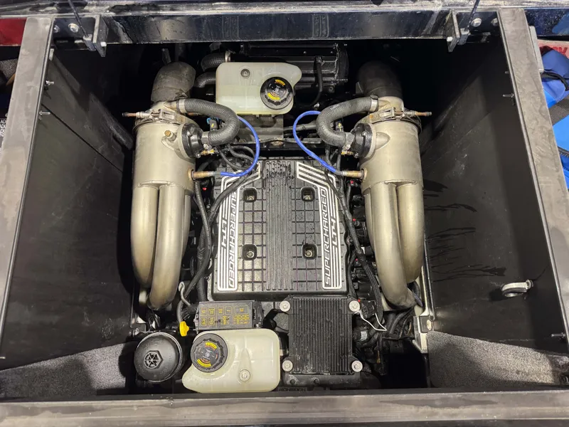 Slide: The Image of Engine compartment of a 2021 Malibu M240 boat with supercharger. - 26