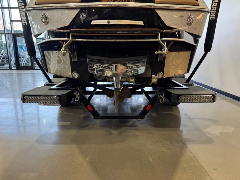 Slide: The Image of Rear view of a 2021 Malibu M240 boat with Power Wedge II. - 6