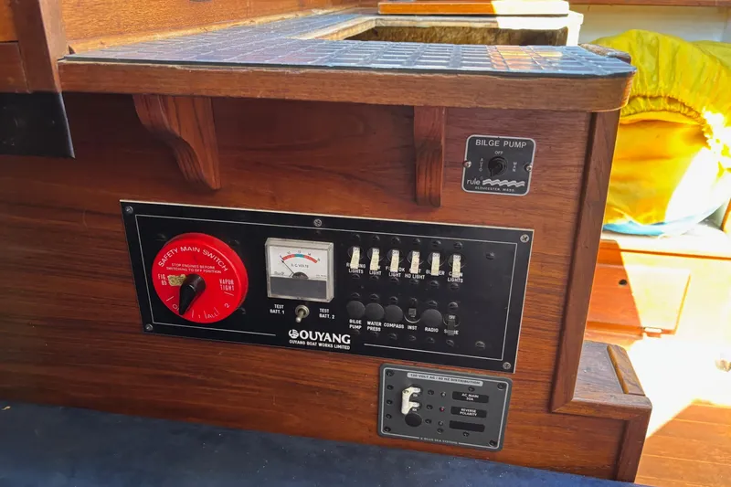Slide: The Image of Electrical panel on a 1979 Aloha 34 sailboat with safety switches and bilge pump controls. - 21