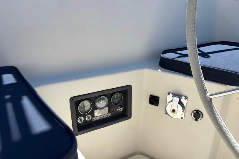 Slide: The Image of 1979 Aloha 34 sailboat cockpit with instrument panel and seating. - 26