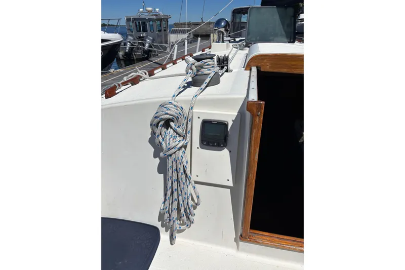 Slide: The Image of Aloha 34 sailboat deck, 1979 model, with coiled rope and navigation equipment. - 27
