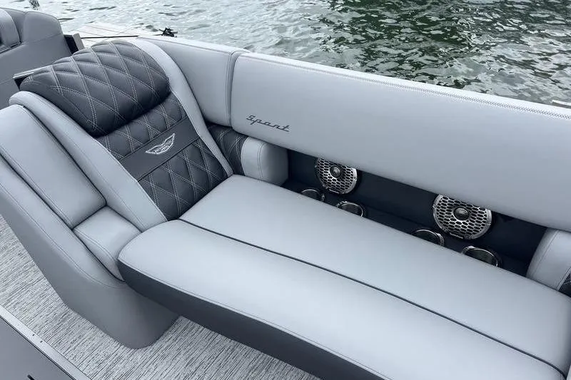 Slide: The Image of Luxurious seating on 2026 Bennington RX 25 RXSBA boat with quilted upholstery and speakers. - 6