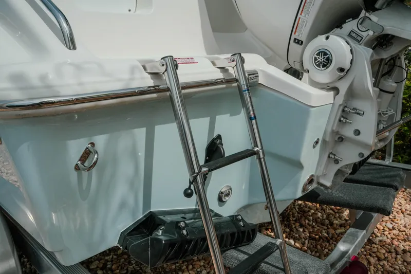 Slide: The Image of 2026 Key West 239 FSR boat stern with ladder and Yamaha engine detail. - 14