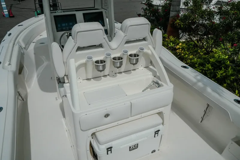Slide: The Image of 2026 Key West 239 FSR boat interior with seating and cup holders. - 17