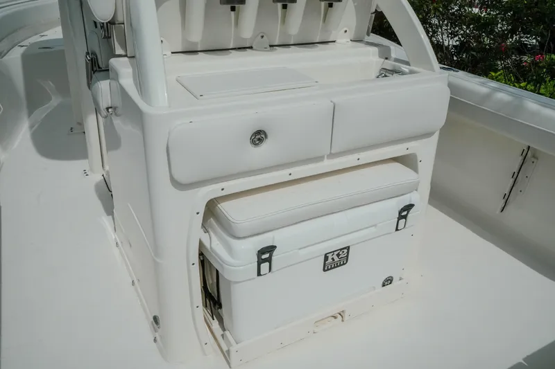 Slide: The Image of 2026 Key West 239 FSR boat interior with storage and cooler compartment. - 18
